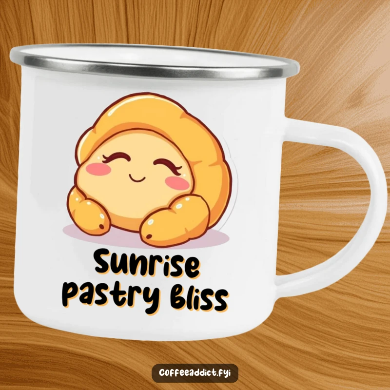 Funny camping mug featuring a sleepy croissant character waking up with a smile, perfect for enjoying warm drinks outdoors.