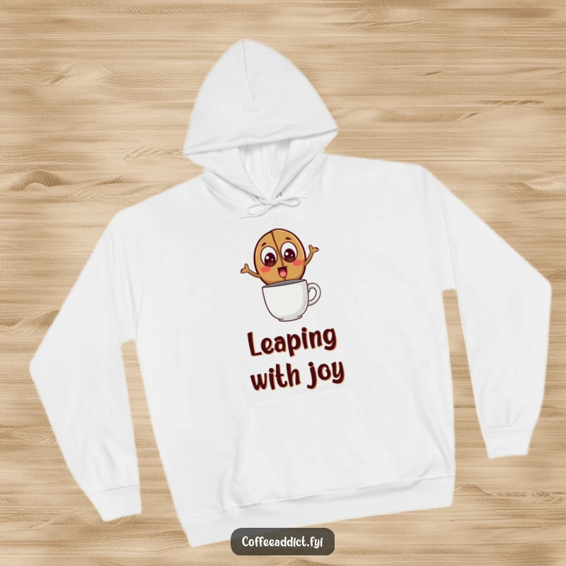 Funny Hoodie featuring a coffee bean with excited eyes leaping over a steaming mug, designed for comfort and energetic vibes.