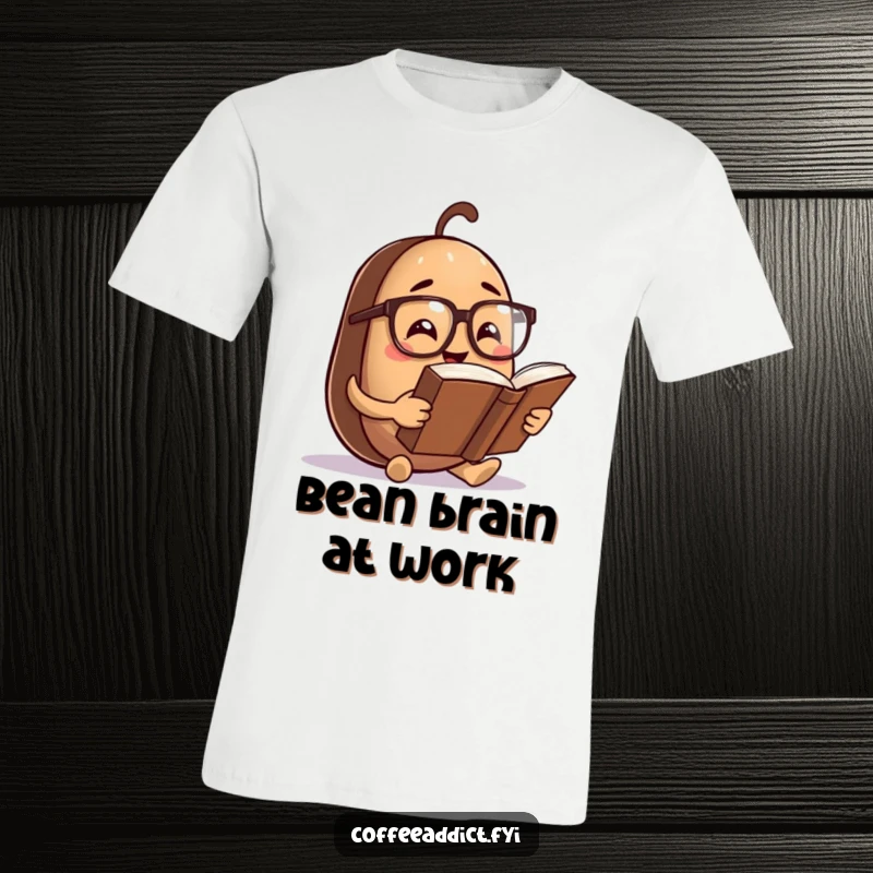 Funny T-Shirt: Coffee bean character with spectacles, deeply focused on reading a comically oversized book with a humorous expression.